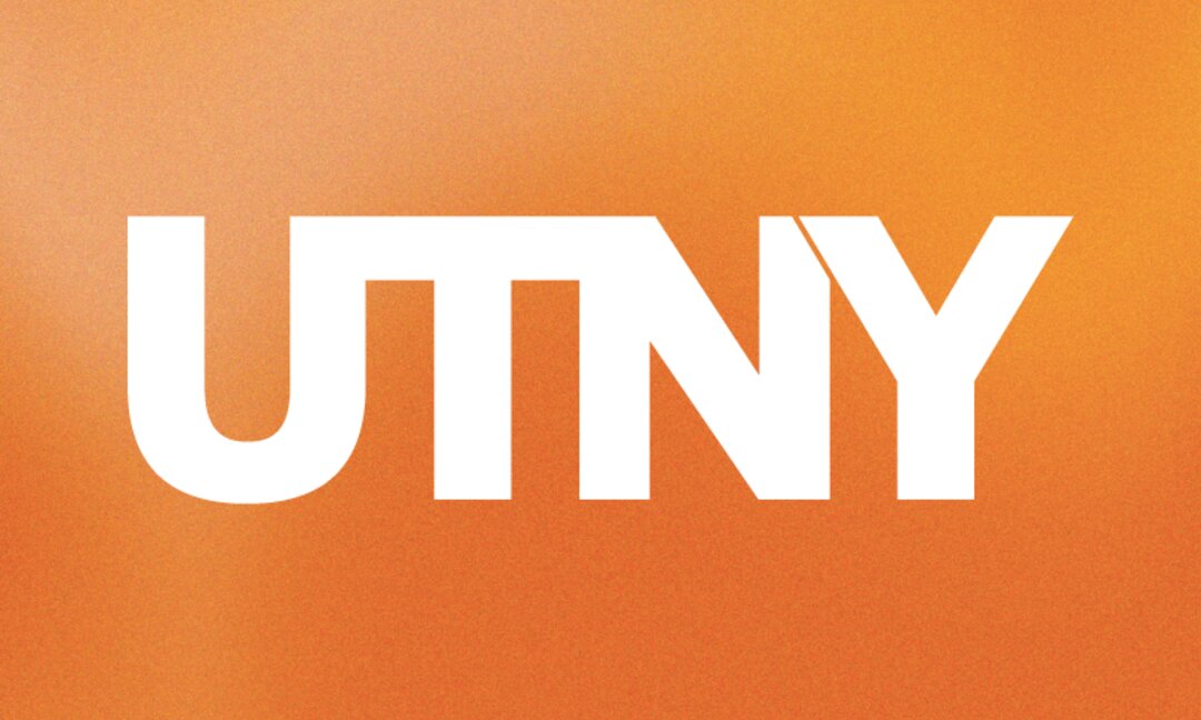 Letters UTNY in bold white on a cloudy orange background